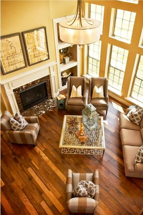 Traditonal living room ideas - this 2 story living room is more modern but sure is a comfy living room with its warm colors.