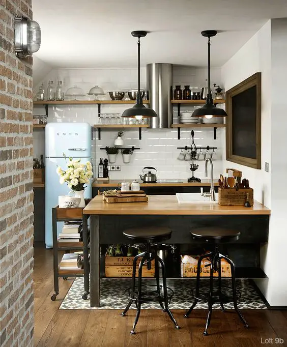 Small tiny condo kitchen layout idea - great space-saving ideas to get more room in a very small kitchen.  Love the brick accent wall and small bar stools.  Get more unique small kitchen ideas here