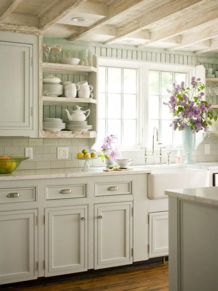 Shabby chic white country cottage kitchen.  LOVE the rustic ceiling and old farmhouse charm.