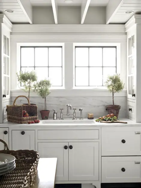 Stunning white farmhouse cottage kitchen.  LOVE how open and bright it is - and that farmhouse sink is to die for!