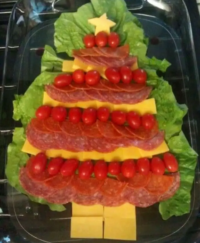 cold appetizers for christmas party - ingredient cold appetizer snack platter shaped like christmas tree with cheese, meat and tomatoes