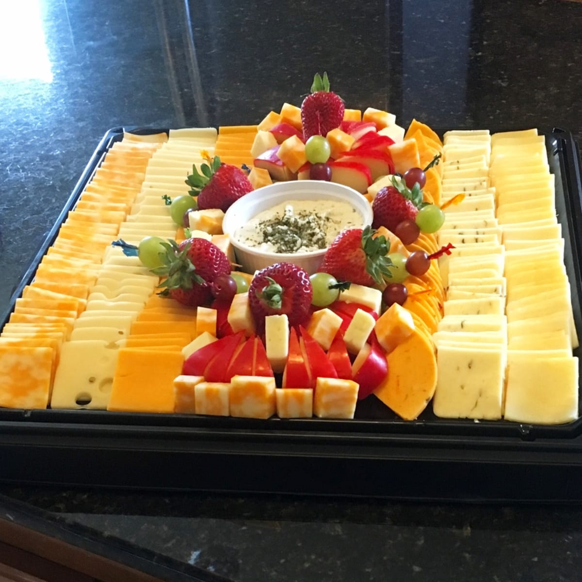 Graduation Open House Party Food Ideas For a Crowd - cold appetizers and finger foods you can make (or buy) on a budget like this fruit and cheese snack platter