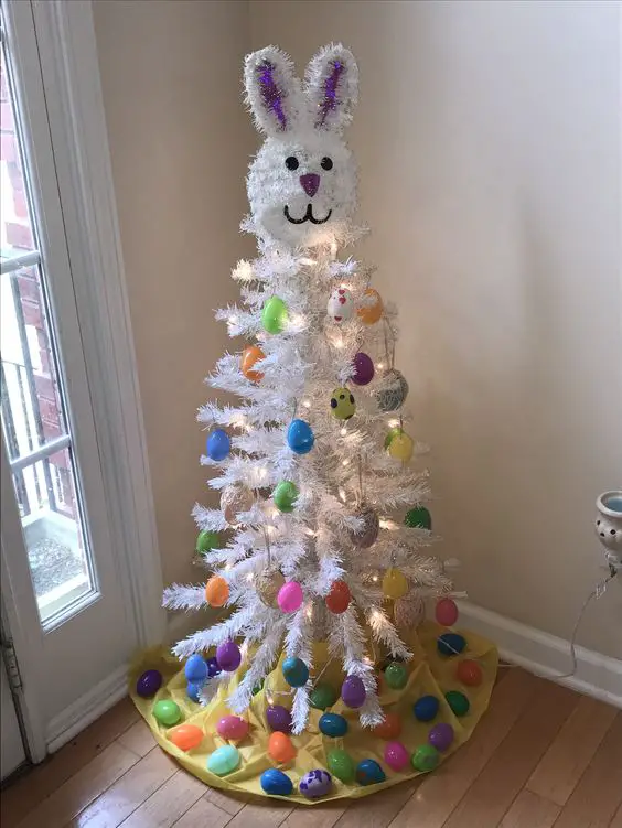 Easter Christmas tree ideas - decorate an artificial tree for Easter to look like an Easter bunny with plastic eggs
